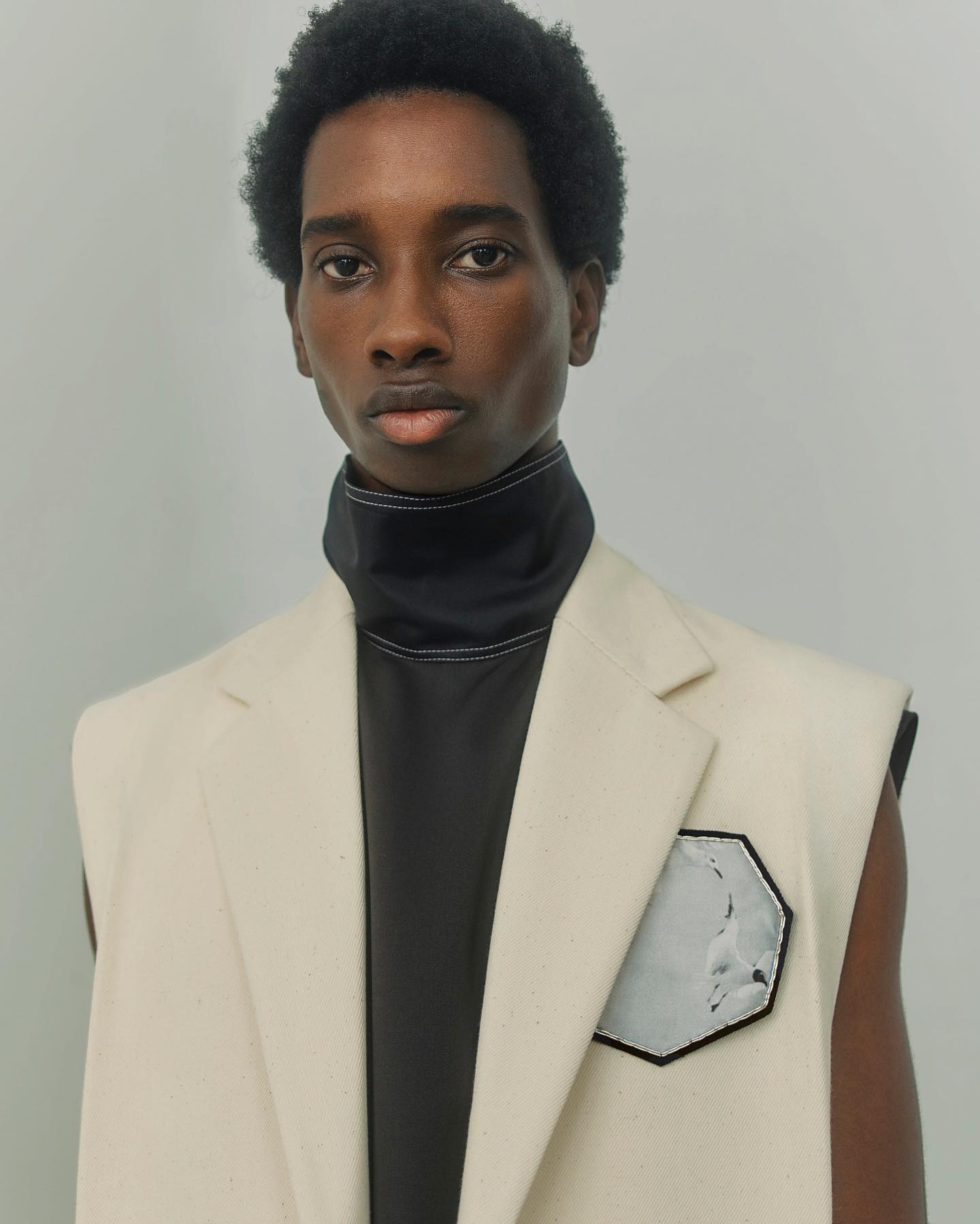 Benoit (@bryann_williams) for OAMC SS21. Photography by Nicolas Kern, hair and makeup by Serena Congiu and casting by Henry Thomas for ARQA.