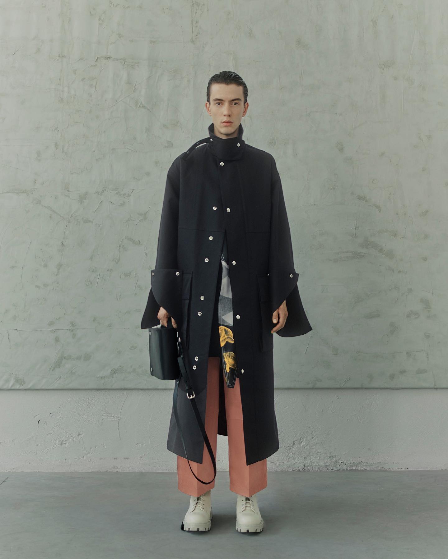 Wim (@wimlionel) for OAMC SS21. Photography by Nicolas Kern, hair and makeup by Serena Congiu and casting by Henry Thomas for ARQA.