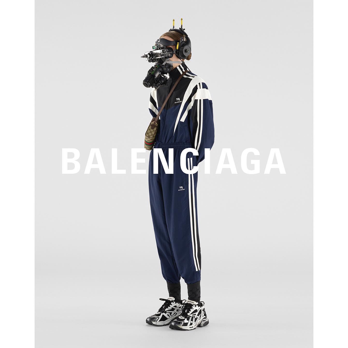 Aki (@nummelaki ) for Balenciaga Spring 22 Campaign. Photography by Andrea Artemisio, video directed by Yilmaz Sen, cybernetic face covering by Ikeuchi Hiroto.