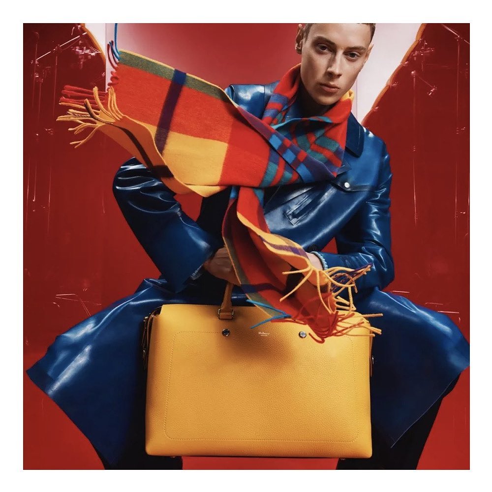 Callum (@callumheslop ) for Mulberry Festive AW22. Photography by Dan Beleiu, styling by Alexandra Carl, hair by Takuya Uchiyama, make-up by Grace Sinnott, casting by Troy Fearn.